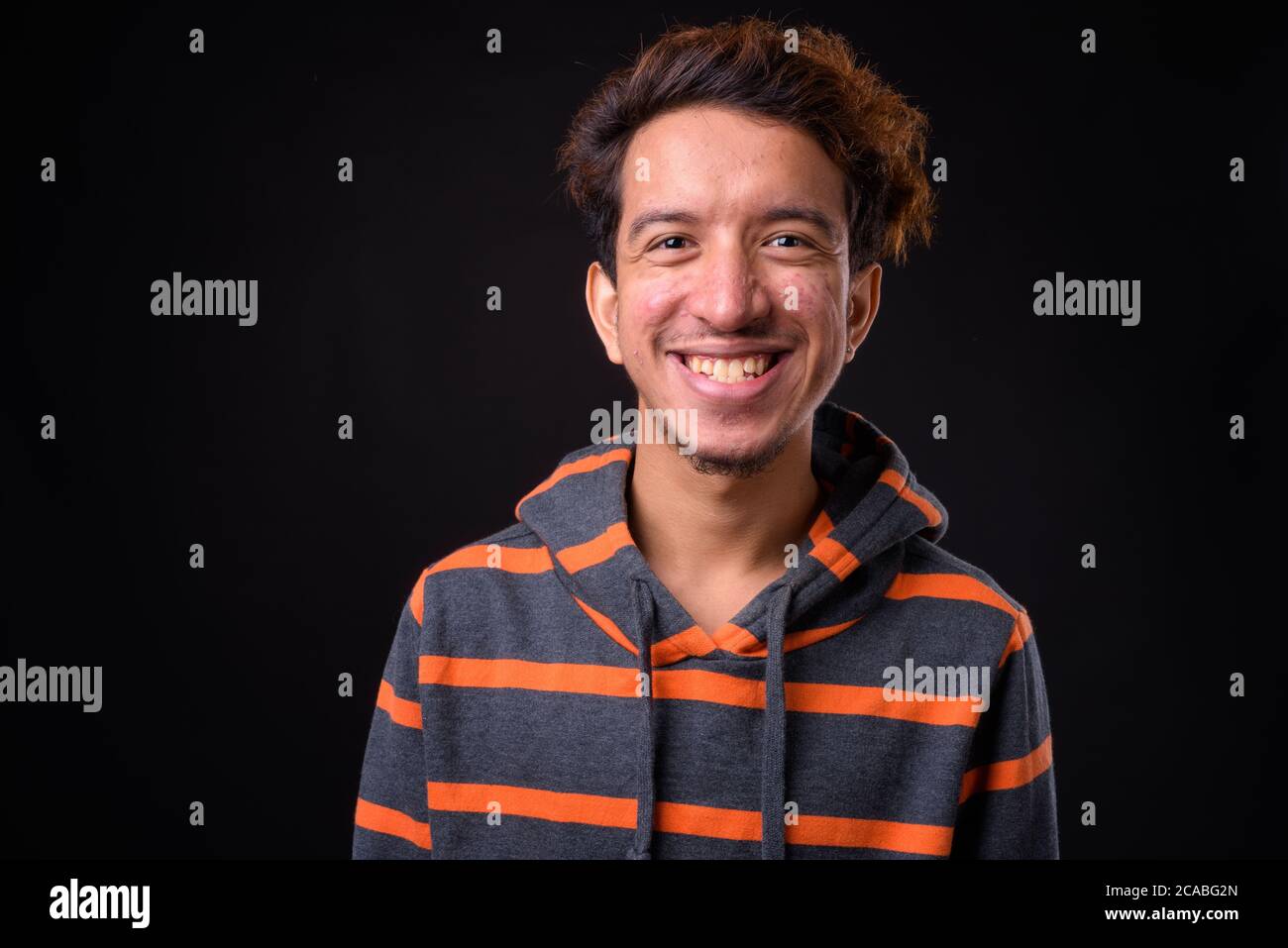Portrait Of Happy Young Asian Man With Curly Hair Stock Photo Alamy