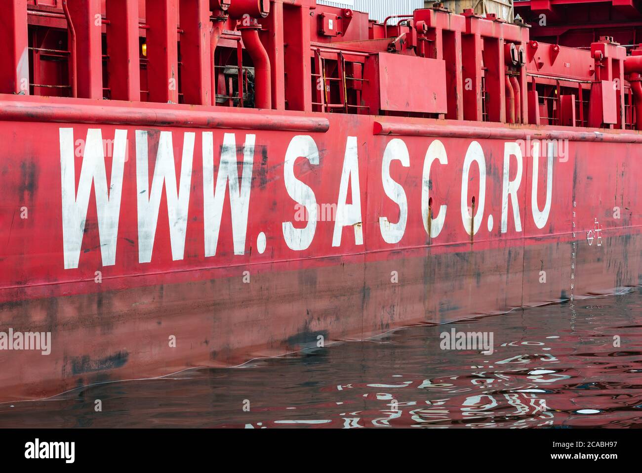 View of side of cargo container ship Sasco Angara with inscription