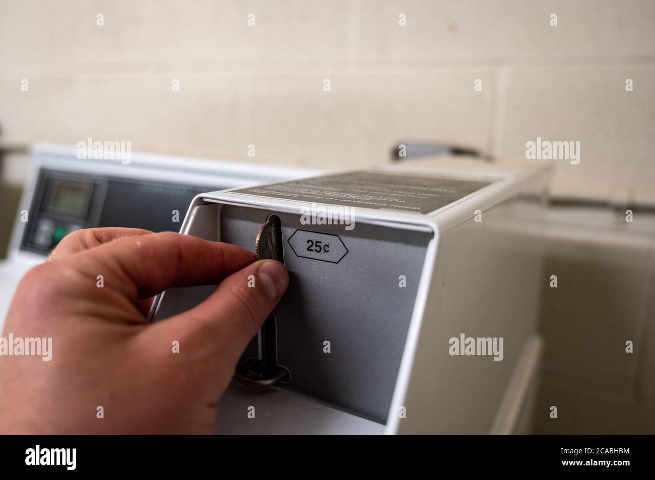 coin operated washing machine common in dorms Stock Photo Alamy