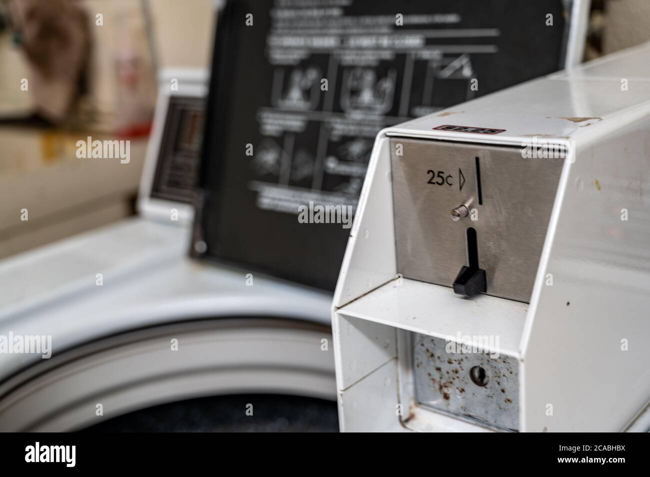 coin operated washing machine common in dorms Stock Photo Alamy