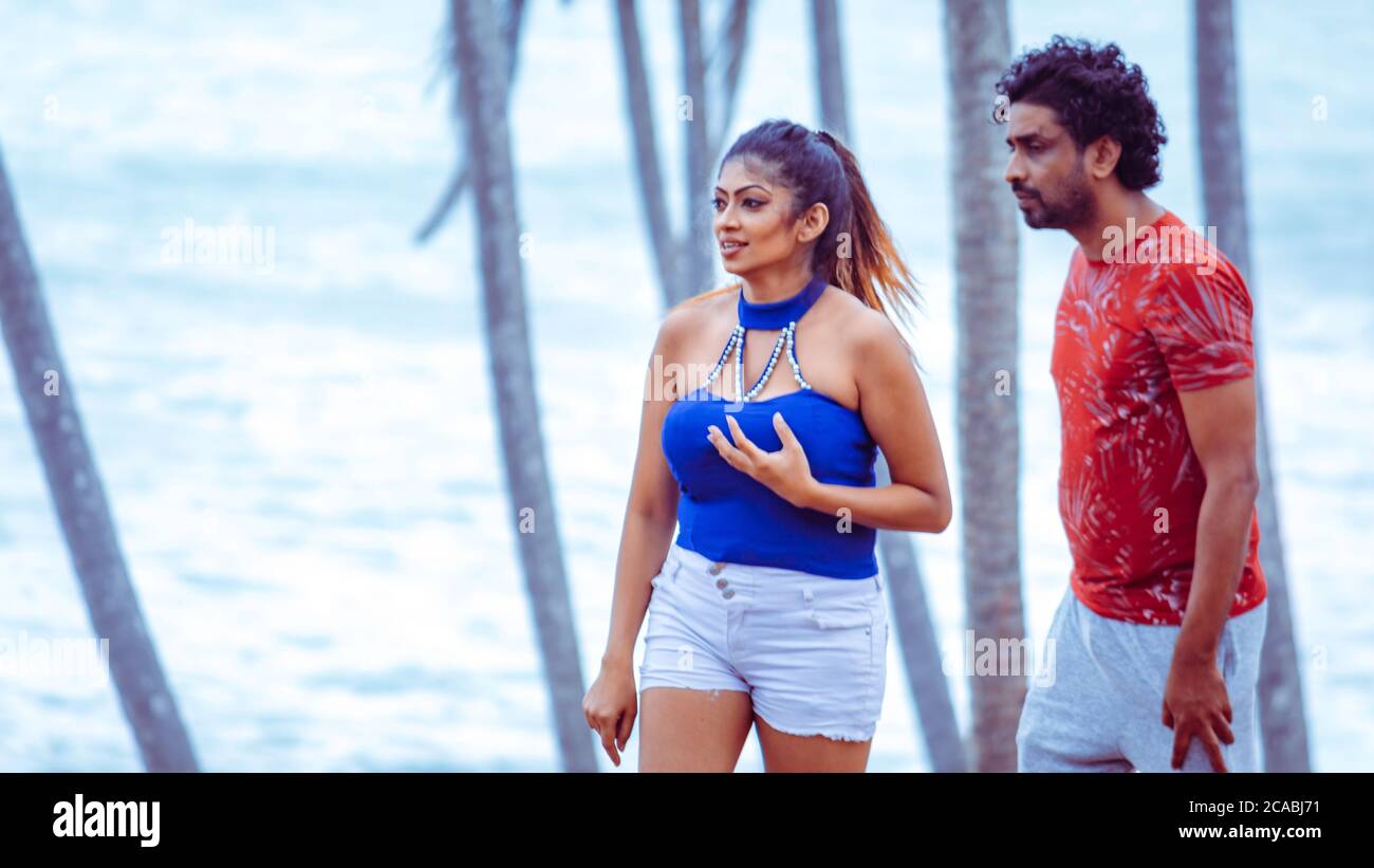 young beautiful Sri Lankan couple in beach location post covid situation Stock Photo