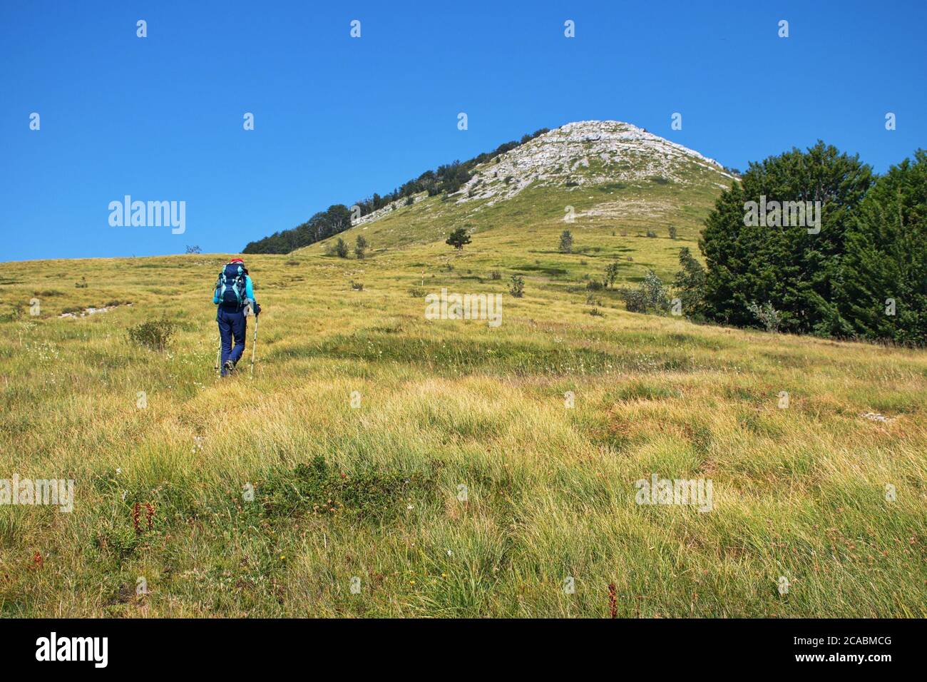 Senior woman hiking in Velebit mountain, Croatia Stock Photo