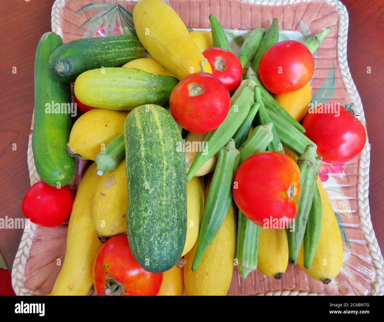 Summer vegetables, cucumbers, squash, okra and tomatoes Stock Photo