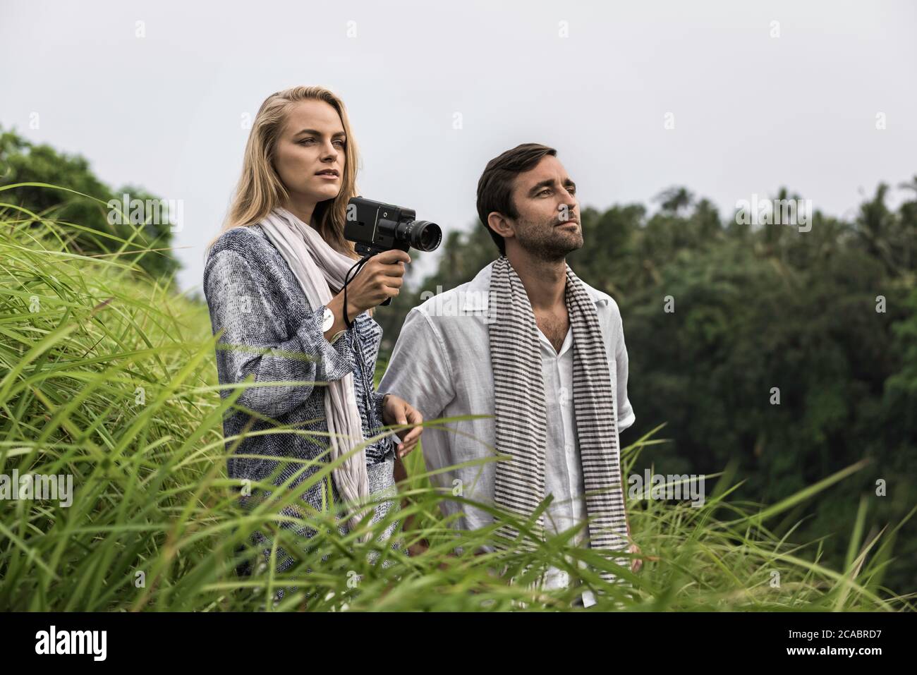 Asia, Indonesia, Bali, young Caucasian couple, wearing smart casual clothing, enjoying a walk along the famous Campuan ridge, one of the well known to Stock Photo