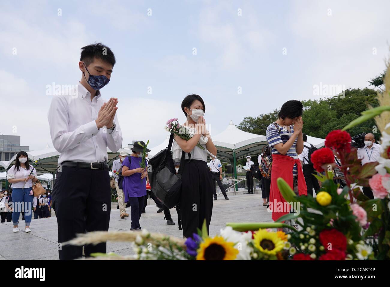 People praying at the Hiroshima Peace Memorial Ceremony.Hiroshima marks the 75th anniversary of the U.S. atomic bombing which killed about 150,000 people and destroyed the entire city during World War II. Stock Photo