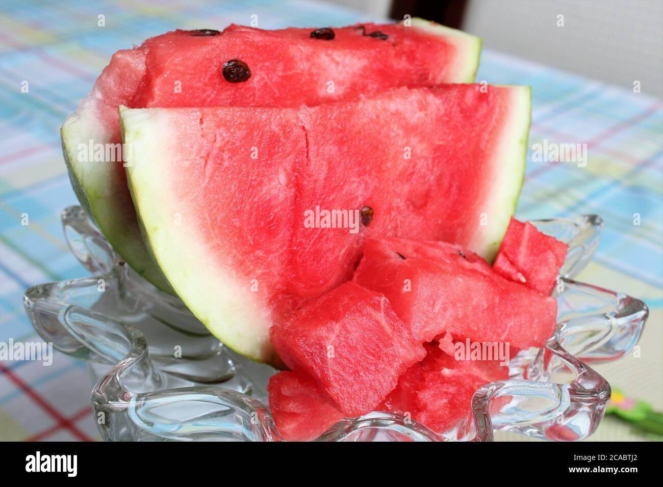 A slice of fresh, ripe watermelon on a glass plate Stock Photo