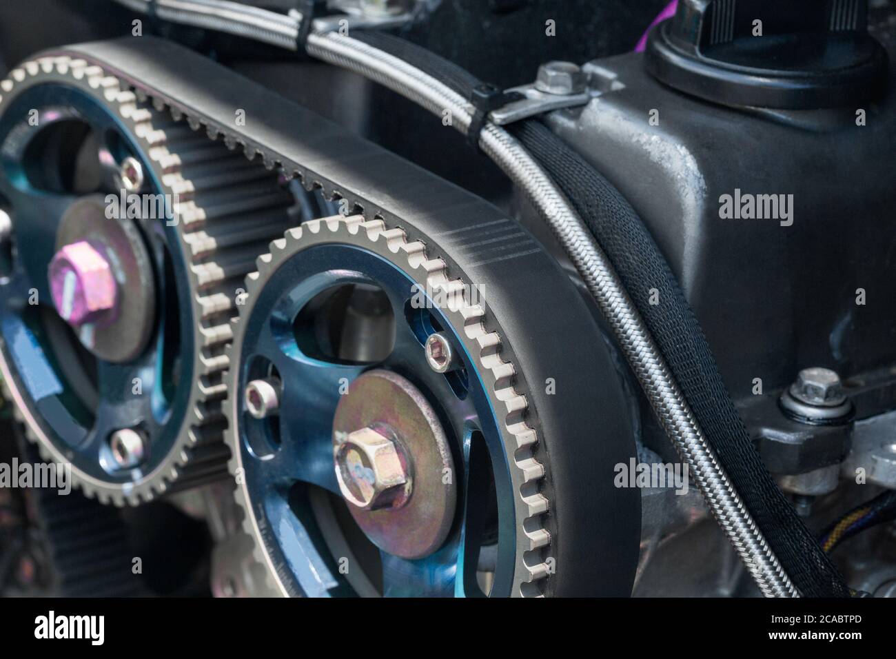 Timing belt and twin camshaft sprocket in engine racing car. Stock Photo