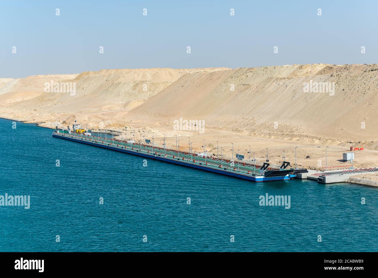 Ismailia, Egypt - November 14, 2019: A long pontoon bridge of the Port Said - Suez Canal Rd on the banks of the Suez Canal near Ismailia, Egypt, Afric Stock Photo