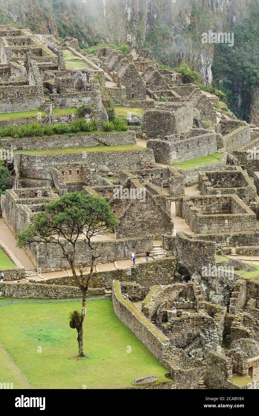 Vertical high angle shot of the ruins of Machu Picchu captured during ...