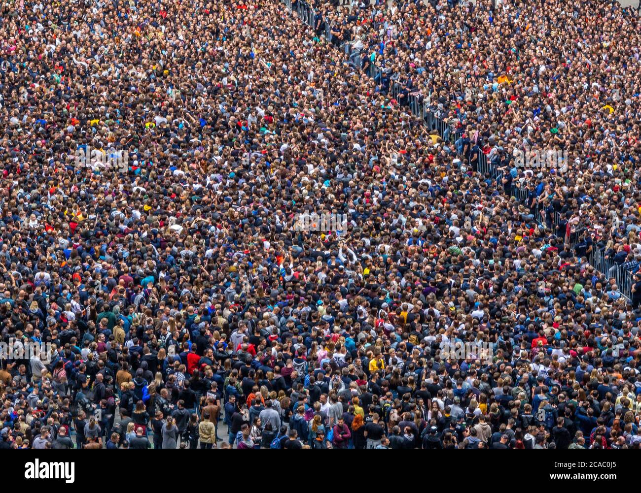 large crowd of spectators having fun at stadium selective focus, defocus Stock Photo