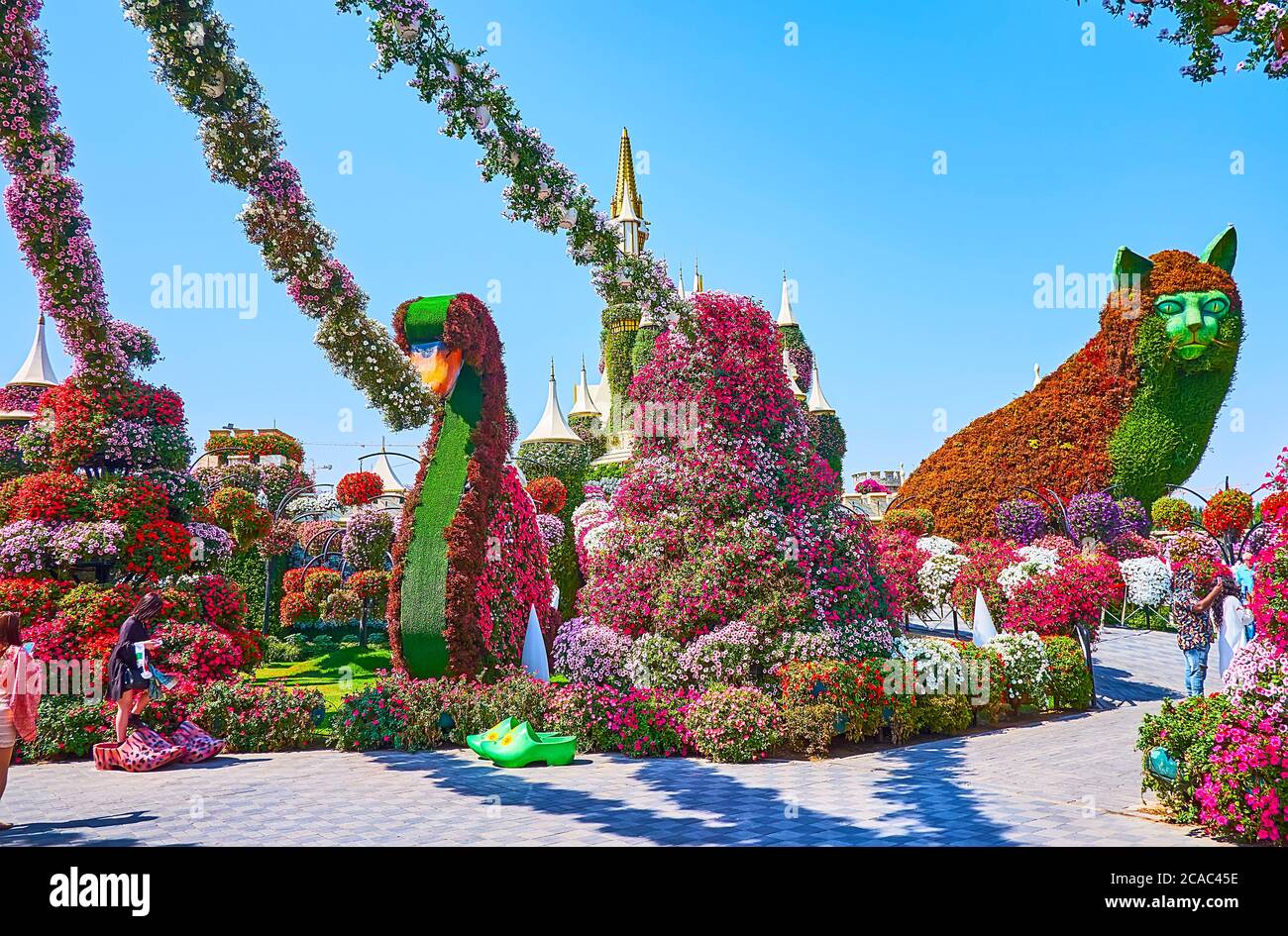 DUBAI, UAE - MARCH 5, 2020: The animals and birds installations in Miracle Garden are surrounded with millions of petunias, growing in flower beds and Stock Photo