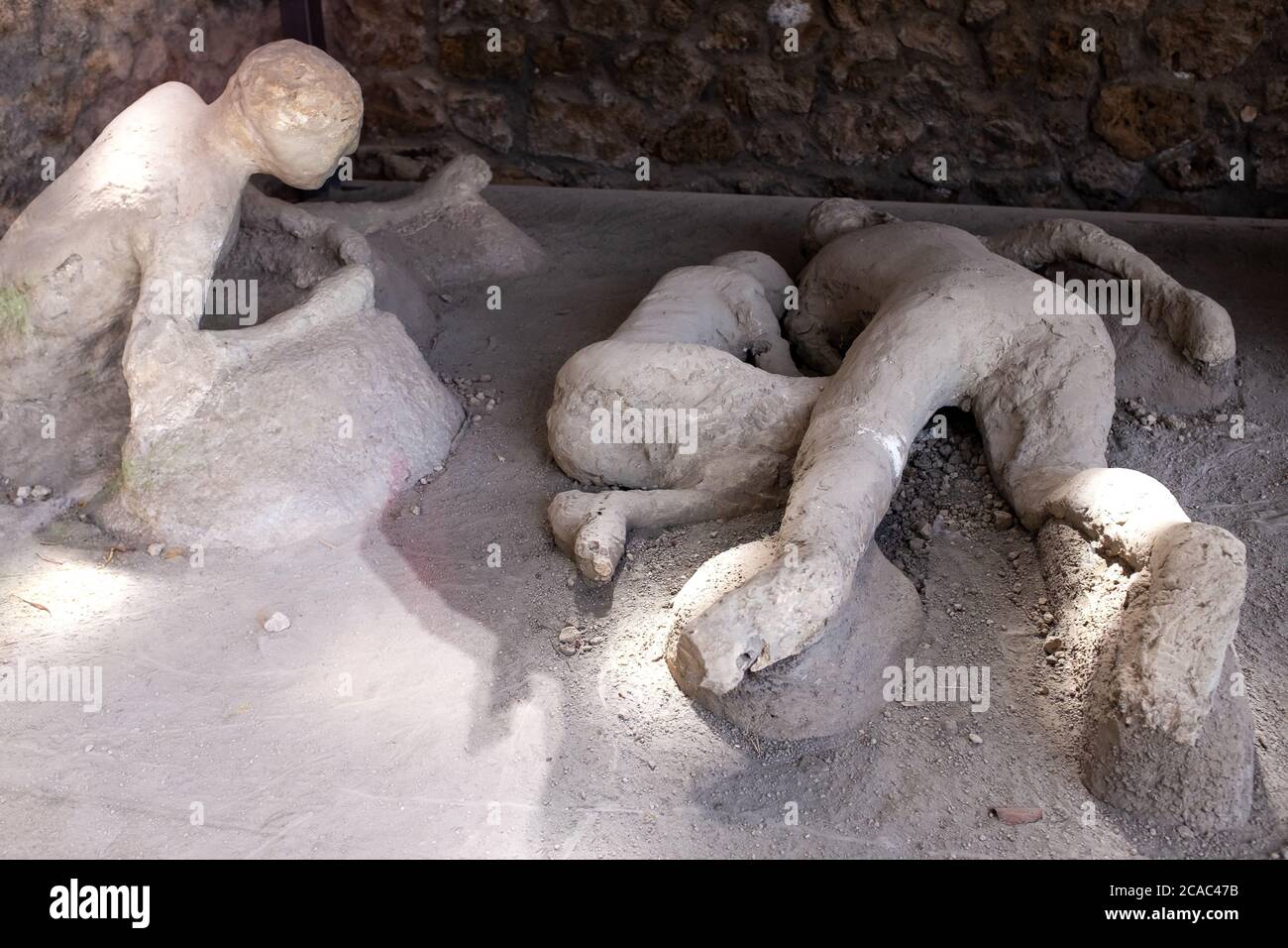 A plaster cast of victims in last moments of the eruption of the volcano Vesuvius 79 BC. Pompeii, Italy Stock Photo