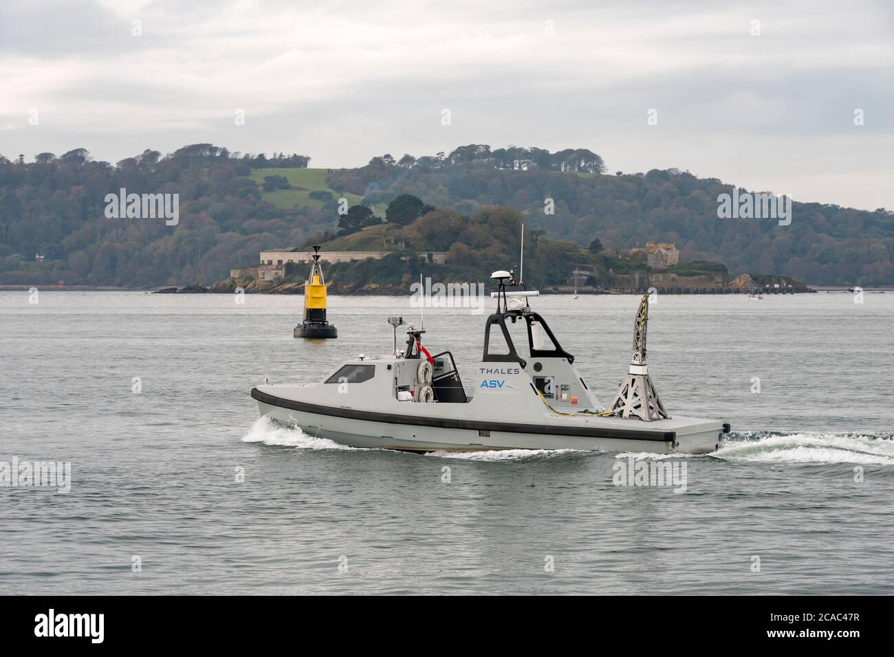 Thales AVS Halcyon military mine countermeasures vessel Unmanned Surface Vehicle USV boat makes her way past Drakes Island in Plymouth Sound Stock Photo