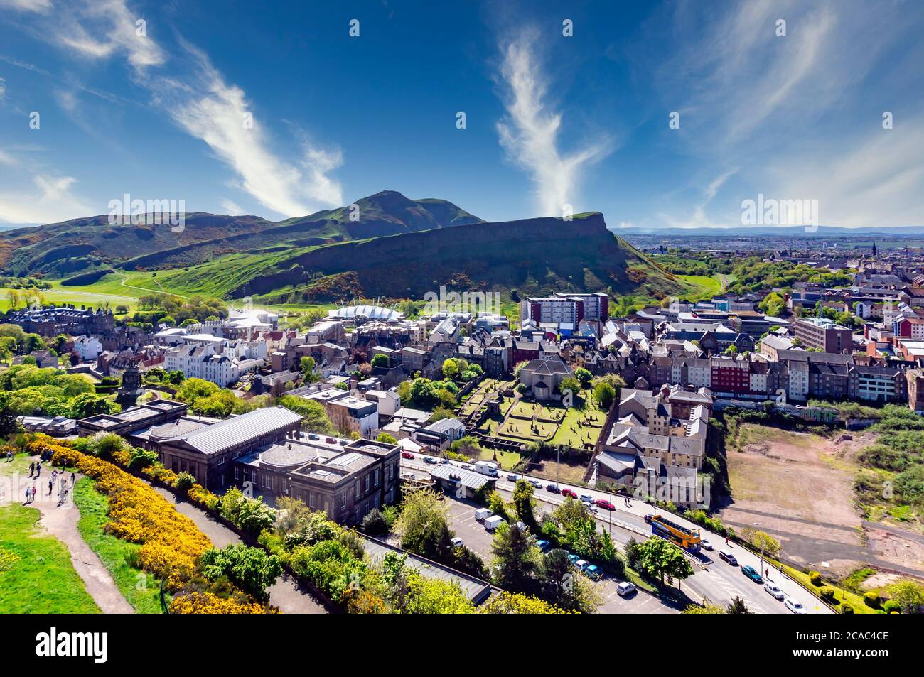 View towards Arthur's Seat in Edinburgh Scotland from Calton Hill with the former Royal High School building in the foreground. Stock Photo