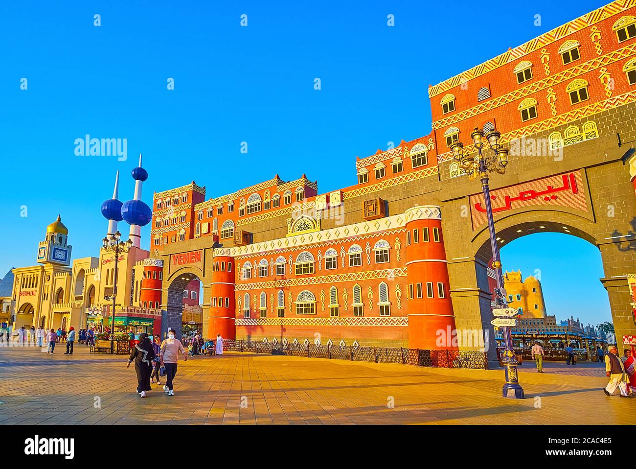 DUBAI, UAE - MARCH 5, 2020: The alley of Global Village, stretching along pavilions of different countries, decorated with their architectural landmar Stock Photo
