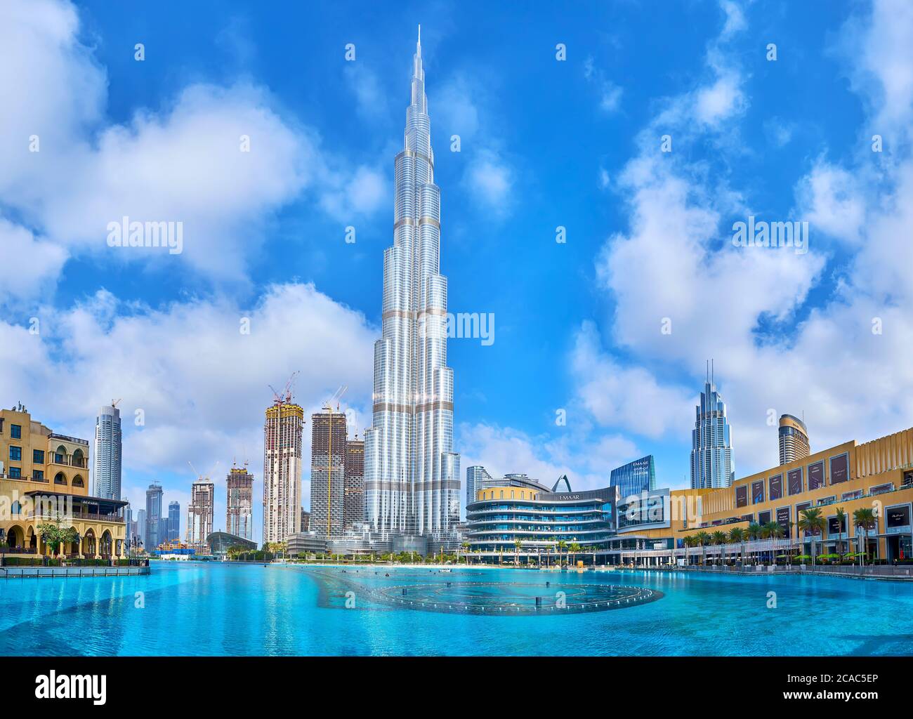 DUBAI, UAE - MARCH 3, 2020: The cityscape of modern Downtown district with Burj Khalifa Lake and the main landmark of the neighborhood, Burj Khalifa b Stock Photo