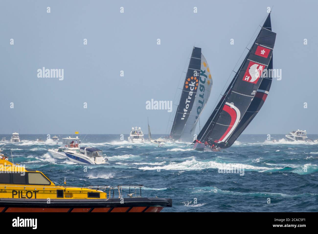 2019 Sydney to Hobart Yacht Race competitors 'InfoTrack' and 'Scallywag' passing South Head into Lady Bay after race start, New South Wales, Australia Stock Photo