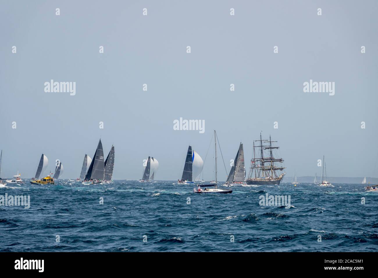 2019 Sydney to Hobart Yacht Race competitors 'Frantic' and 'Oskana' passing South Head into Tasman Sea after race start, New South Wales, Australia Stock Photo