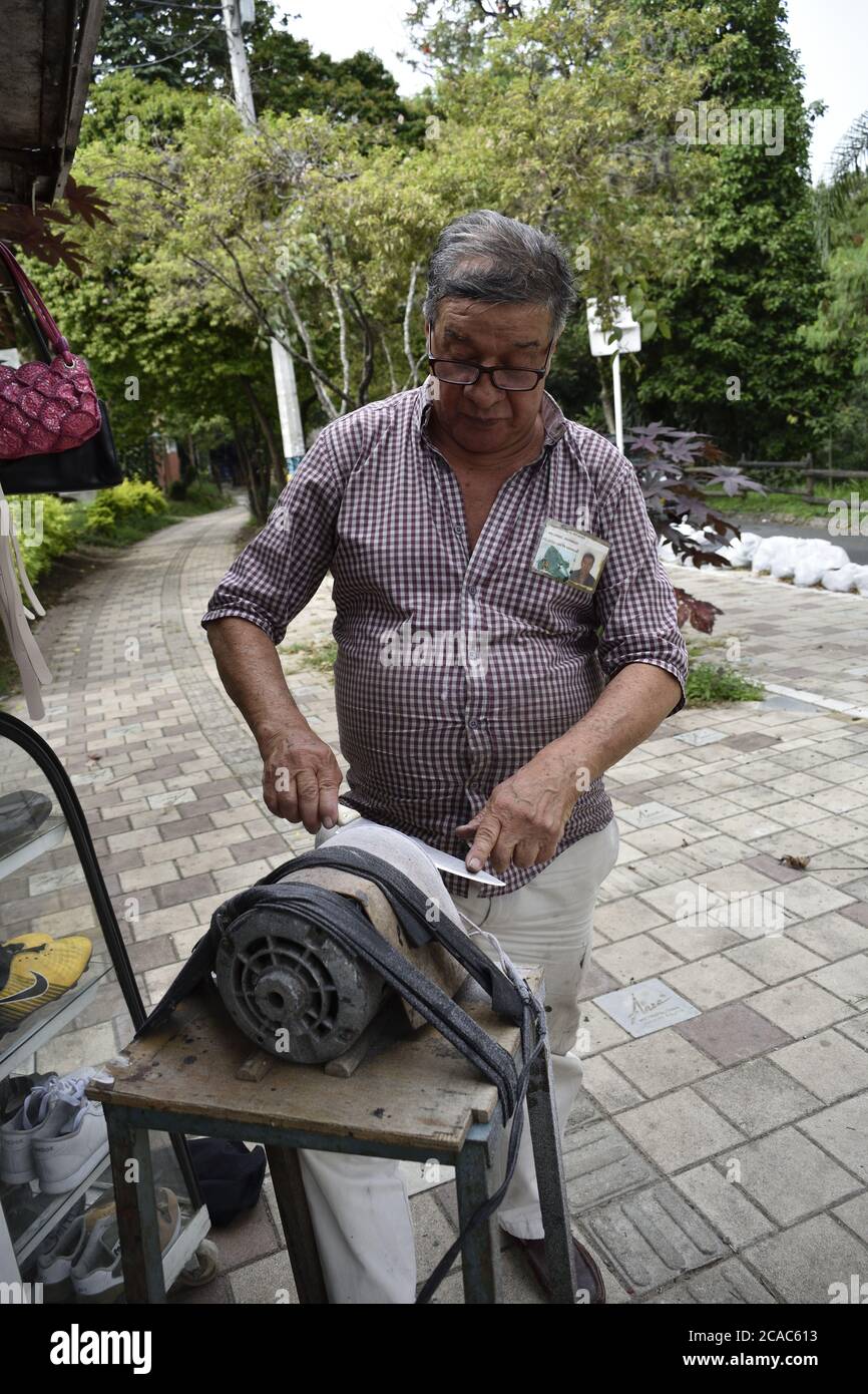 MEDELLIN, COLOMBIA Jun 24, 2020 Mature Latino man sharpening a knife