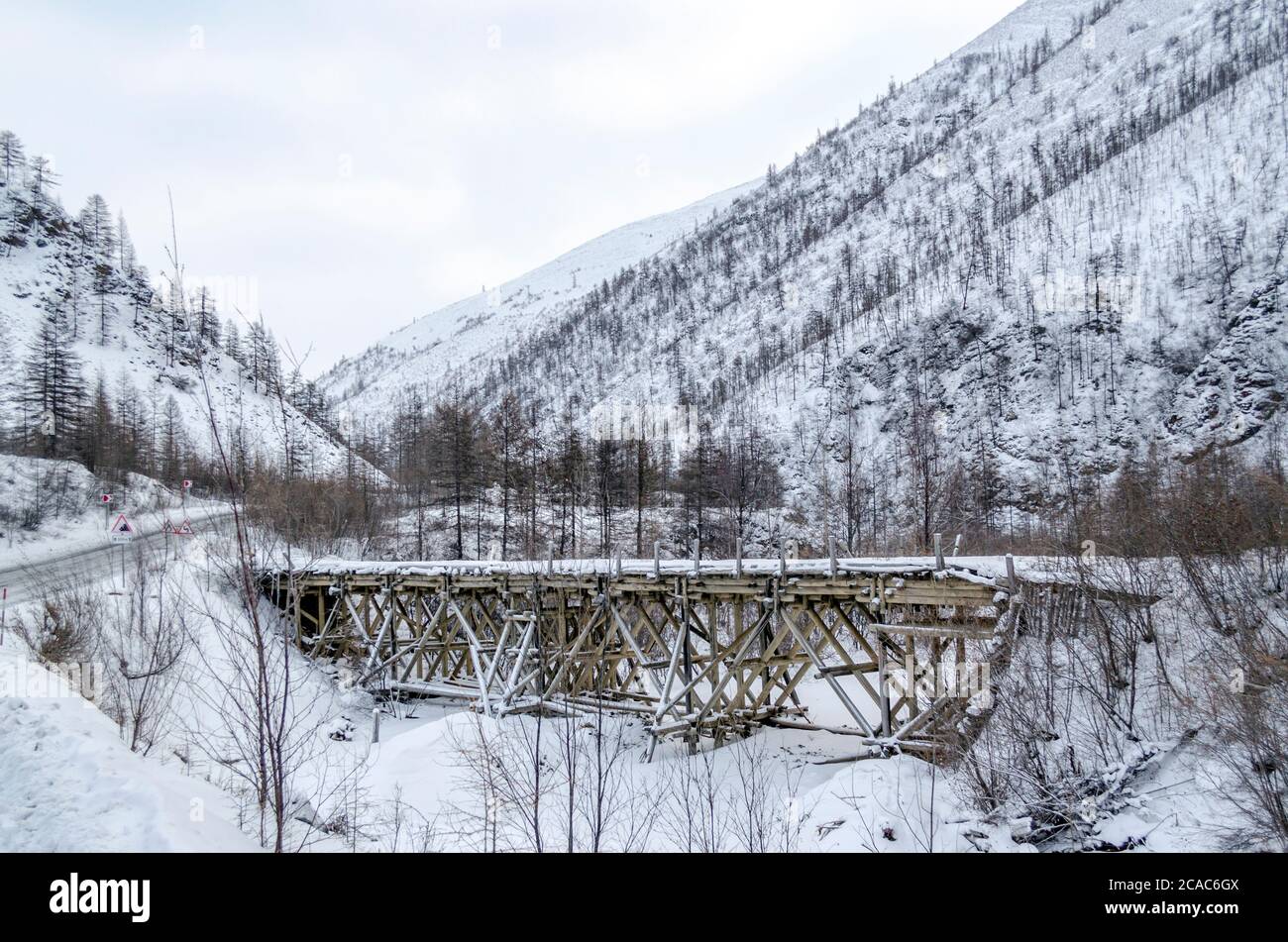 Wooden bridge, snowy mountains, gulag, Kolyma, the R504 Kolyma Highway, the Road of Bones