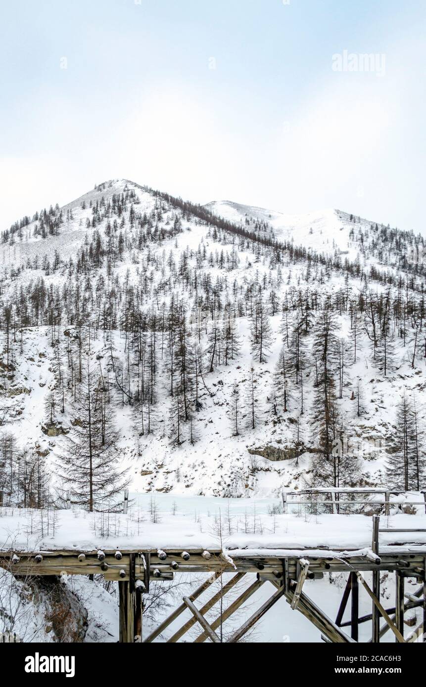 Wooden bridge, snowy mountains, gulag, Kolyma, the R504 Kolyma Highway, the Road of Bones