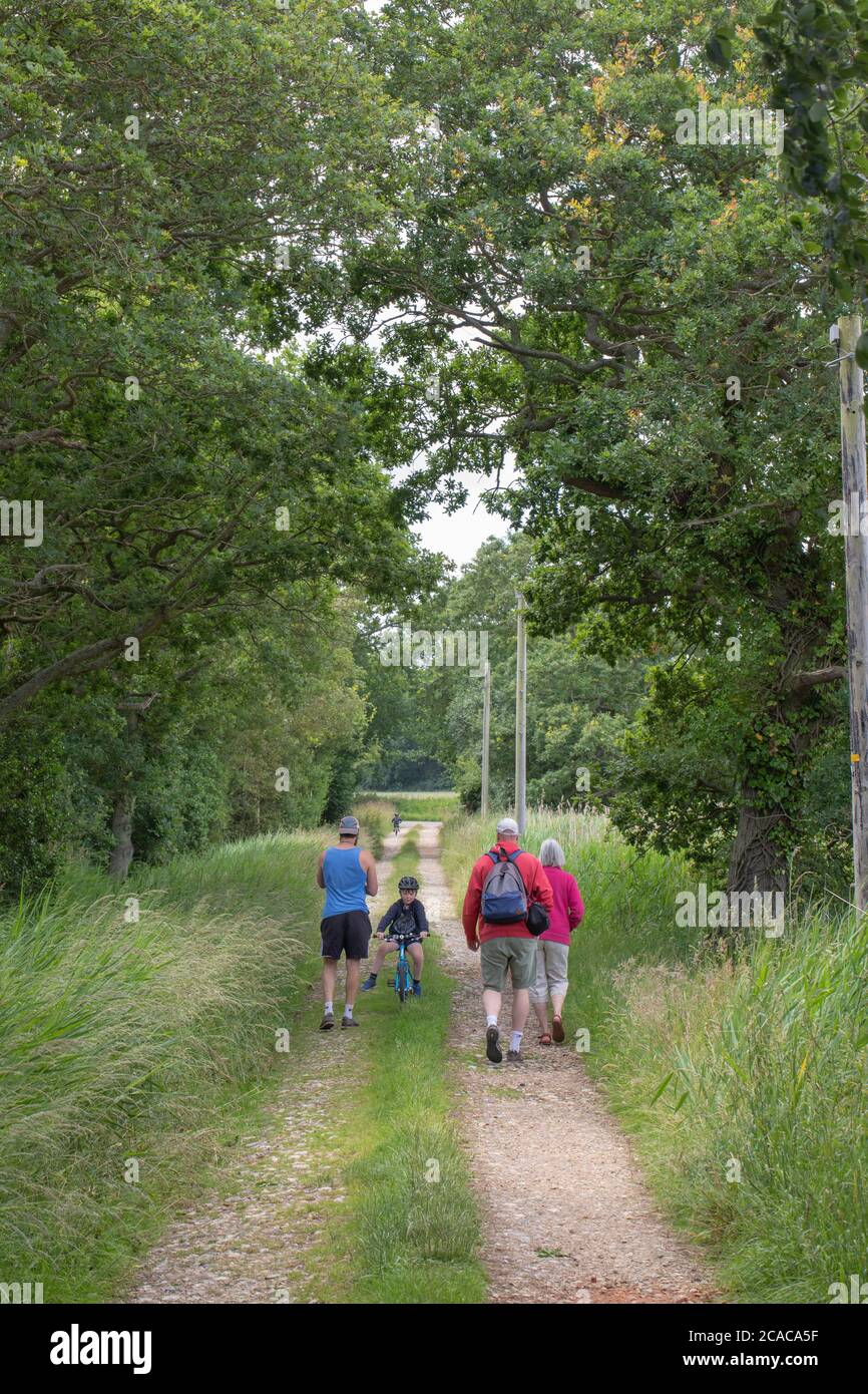ADULTS; CLOSE; FAMILY; MEMBERS; WALKING; SEEKING; MINDFUL; WELLBEING; MAKE A DIFFERENCE; WAYSIDE; WALK; EXERCISE; EXERCISING; SAFE; RURAL; COUNTRYSIDE Stock Photo