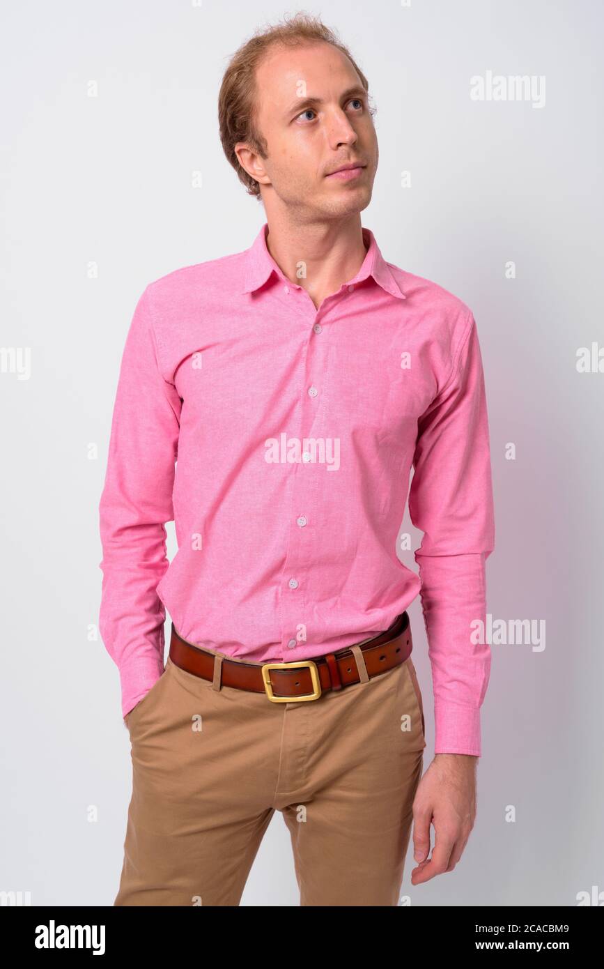 Portrait of businessman with blond hair wearing pink shirt Stock Photo