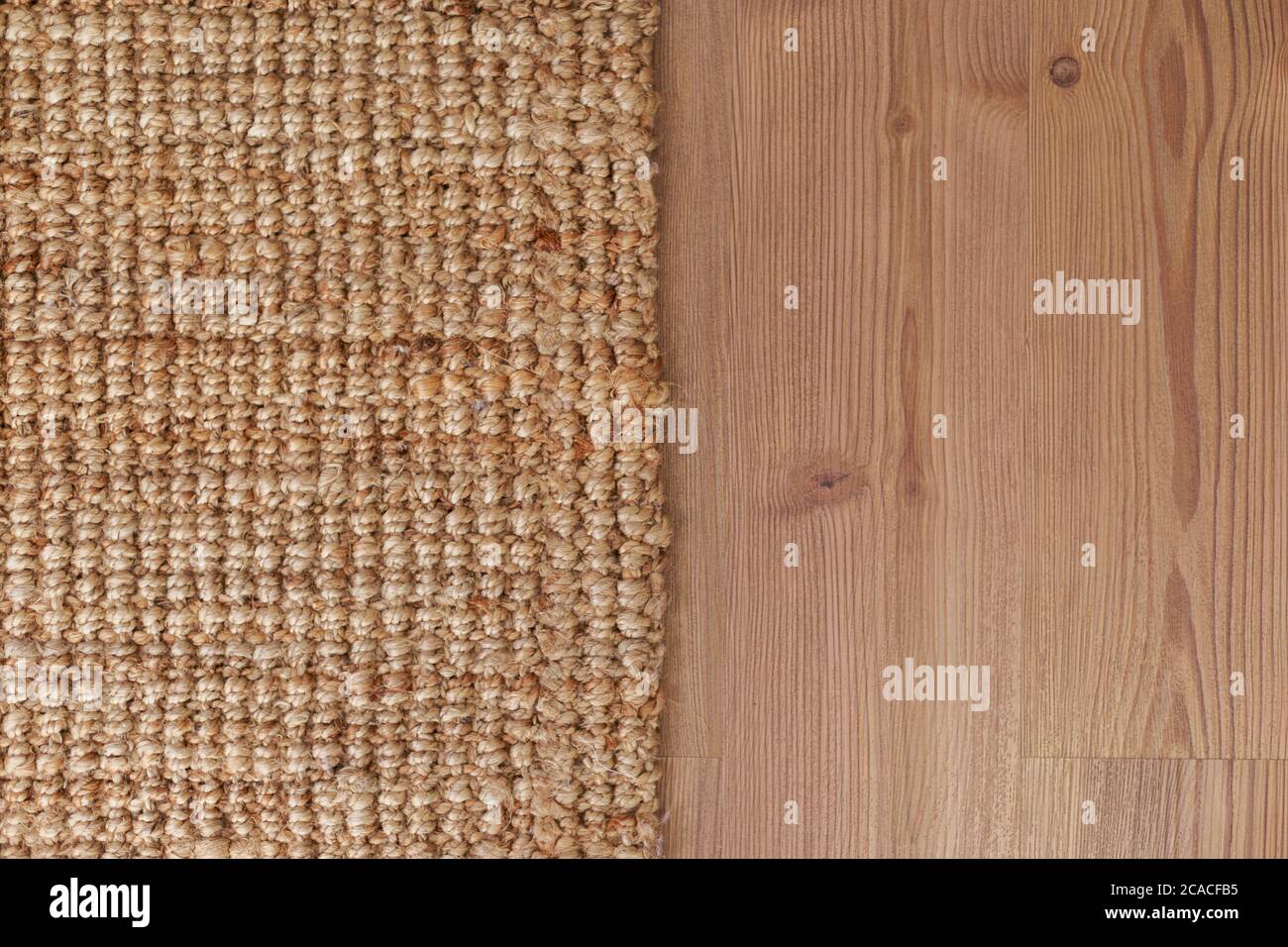 Closeup carpet on laminate wood floor in living room, interior