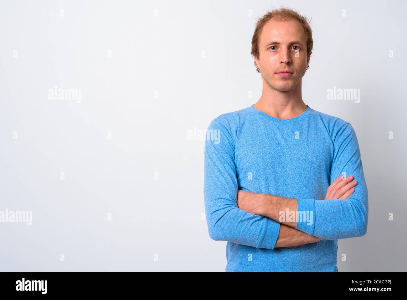 Man with blond hair against white background Stock Photo