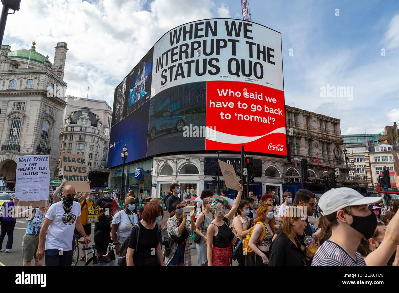 Protesters march under the Piccadilly Lights during a Black Lives Matter demonstration, London, 2 August 2020 Stock Photo