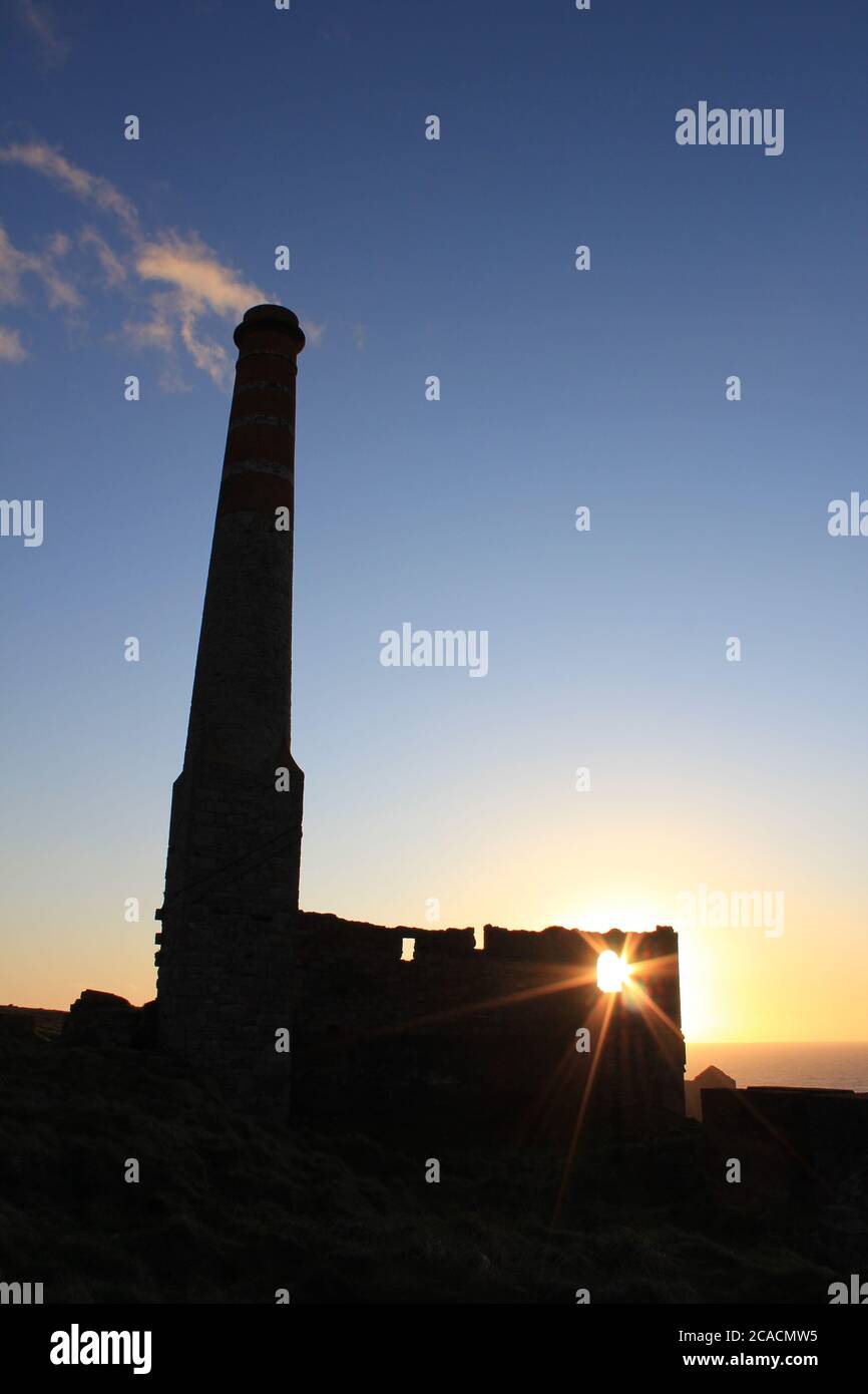 Tin mine chimney at sunset Stock Photo
