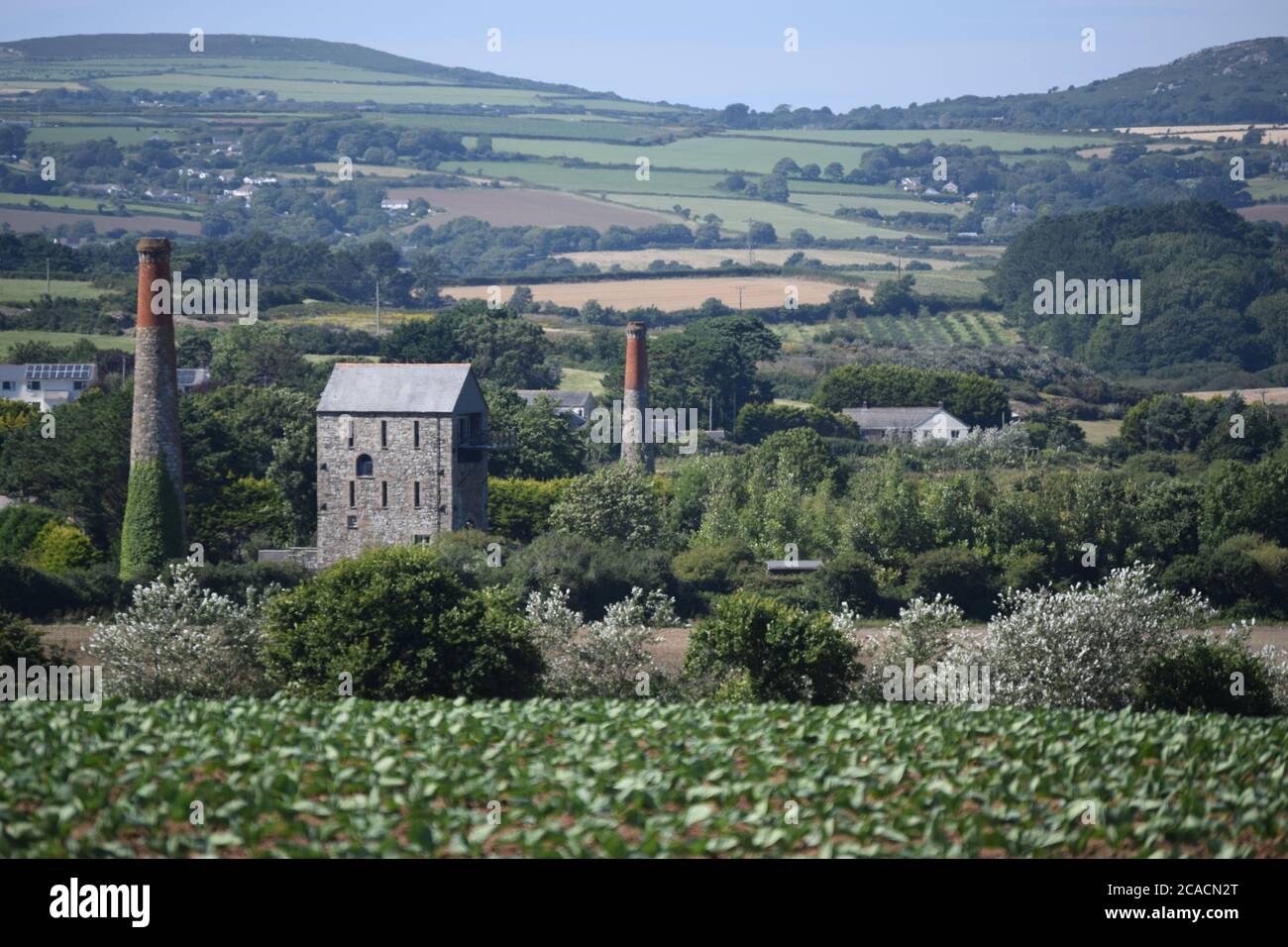 tin mine chimneys in landscape Stock Photo