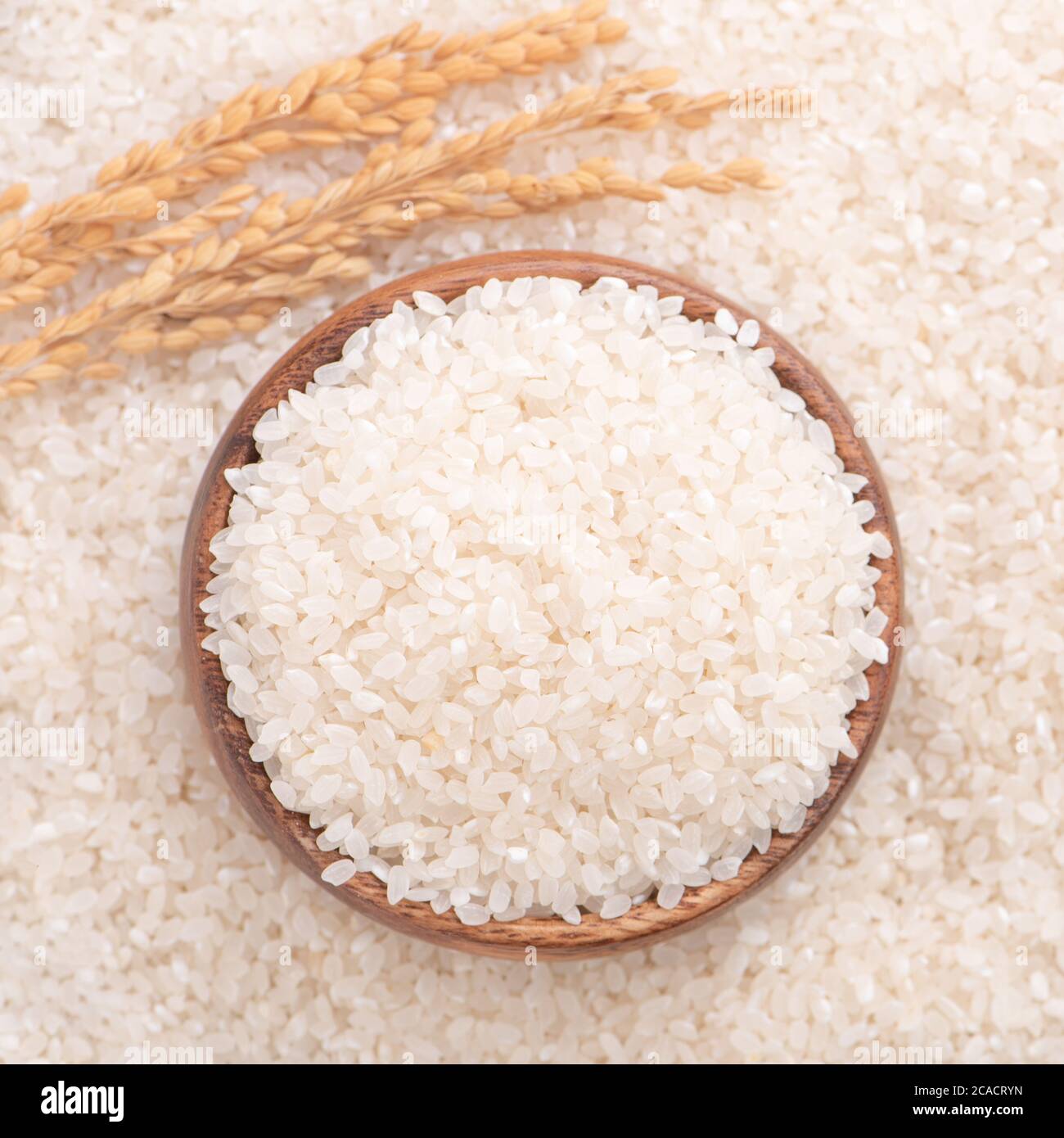 Row Rice Image Raw rice in a bowl and full frame in the white background table, top ...