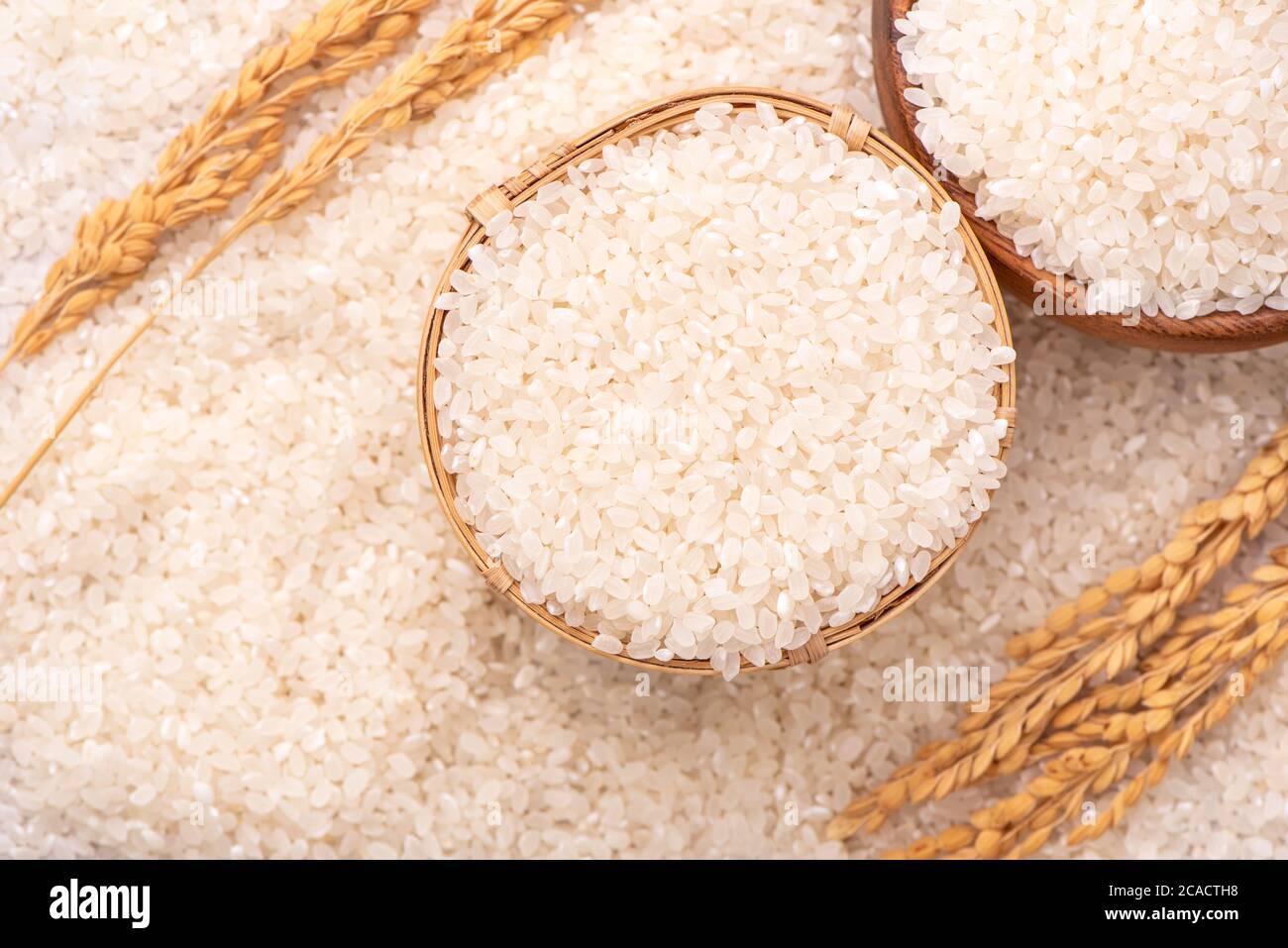 Row Rice Image Raw rice in a bowl and full frame in the white background table, top ...