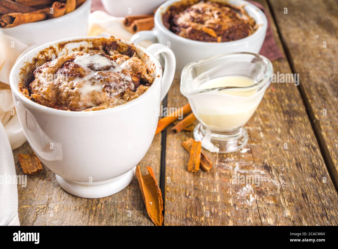 Cinnabon cake in mug. Fast simple microwave dessert idea, background