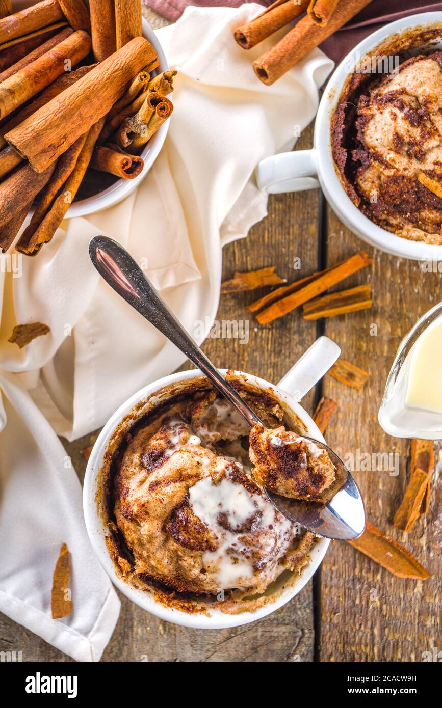 Cinnabon cake in mug. Fast simple microwave dessert idea, background