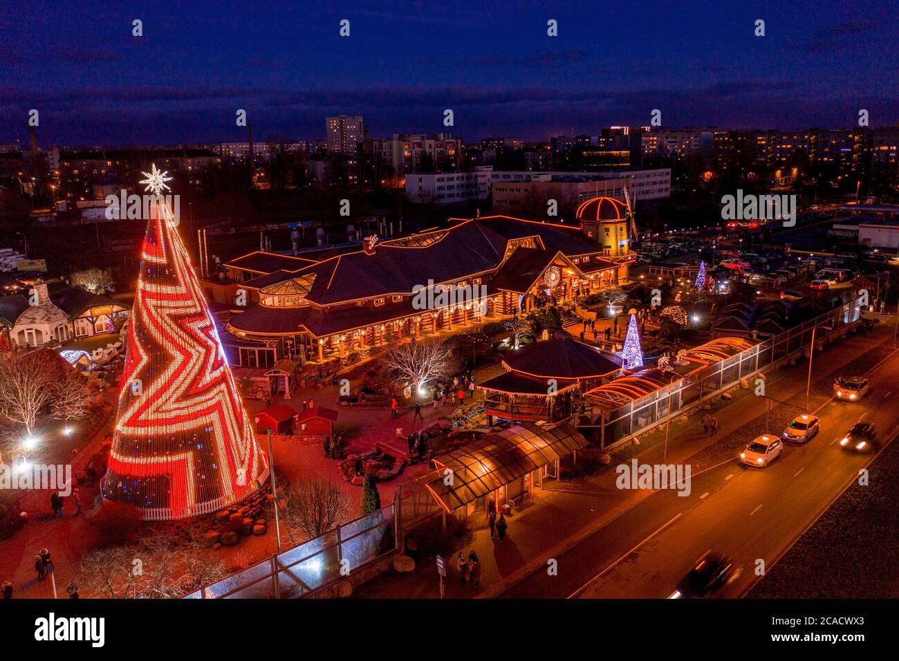Breathtaking shot of people ice skating in the evening in Riga, Latvia ...