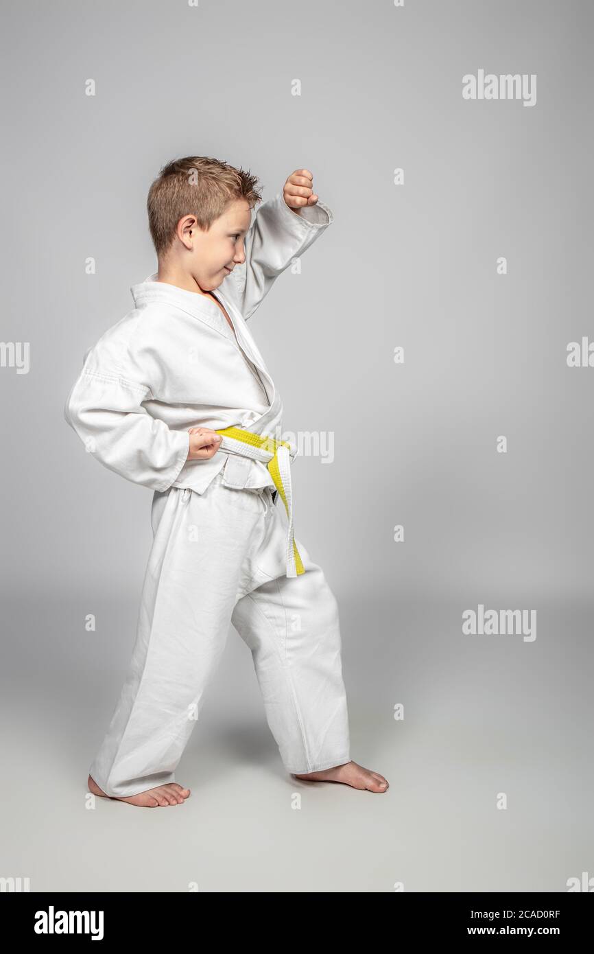 7 year old boy practices jujitsu. Sport and martial arts concept. Stock Photo