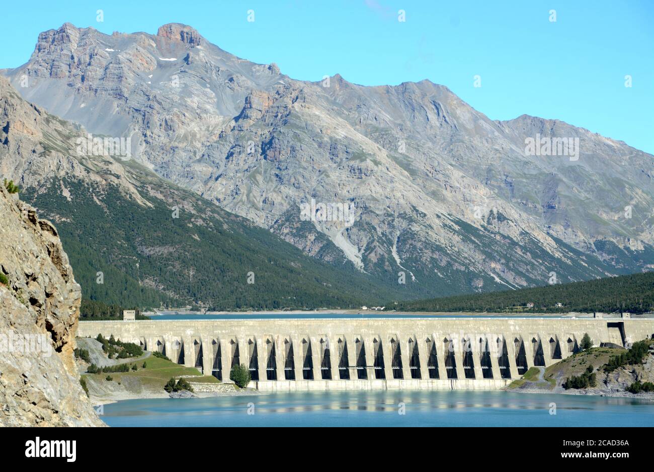 Lake Cancano is an artificial water basin adjacent to Lake San Giacomo near Bormio. The Cancano dam is an engineering project to produce hydroelectric Stock Photo