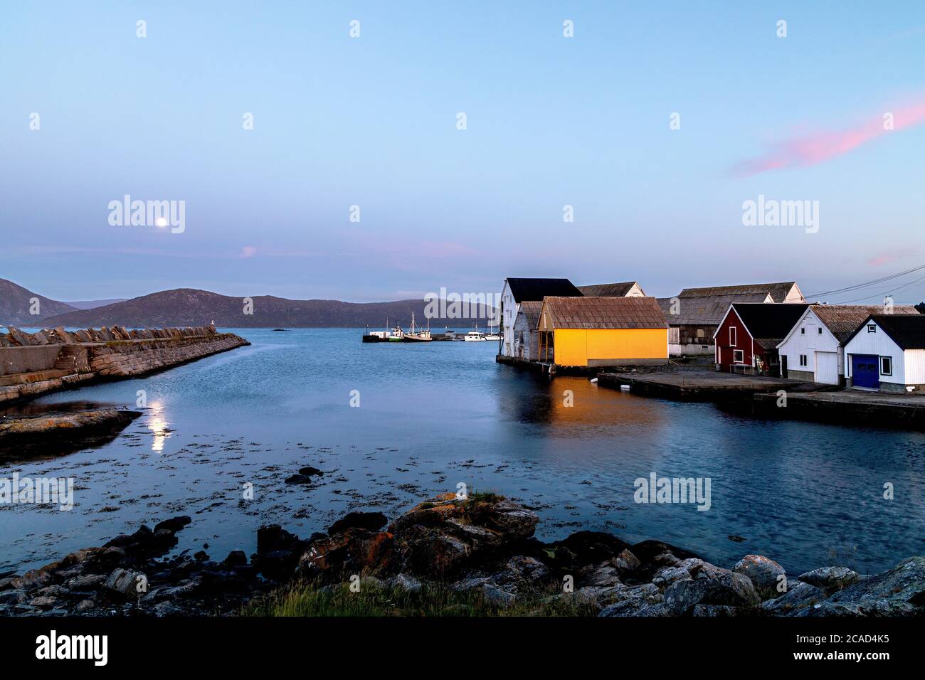 Mid summer night in the small port at  Runde island, on the west coast of Norway. Stock Photo