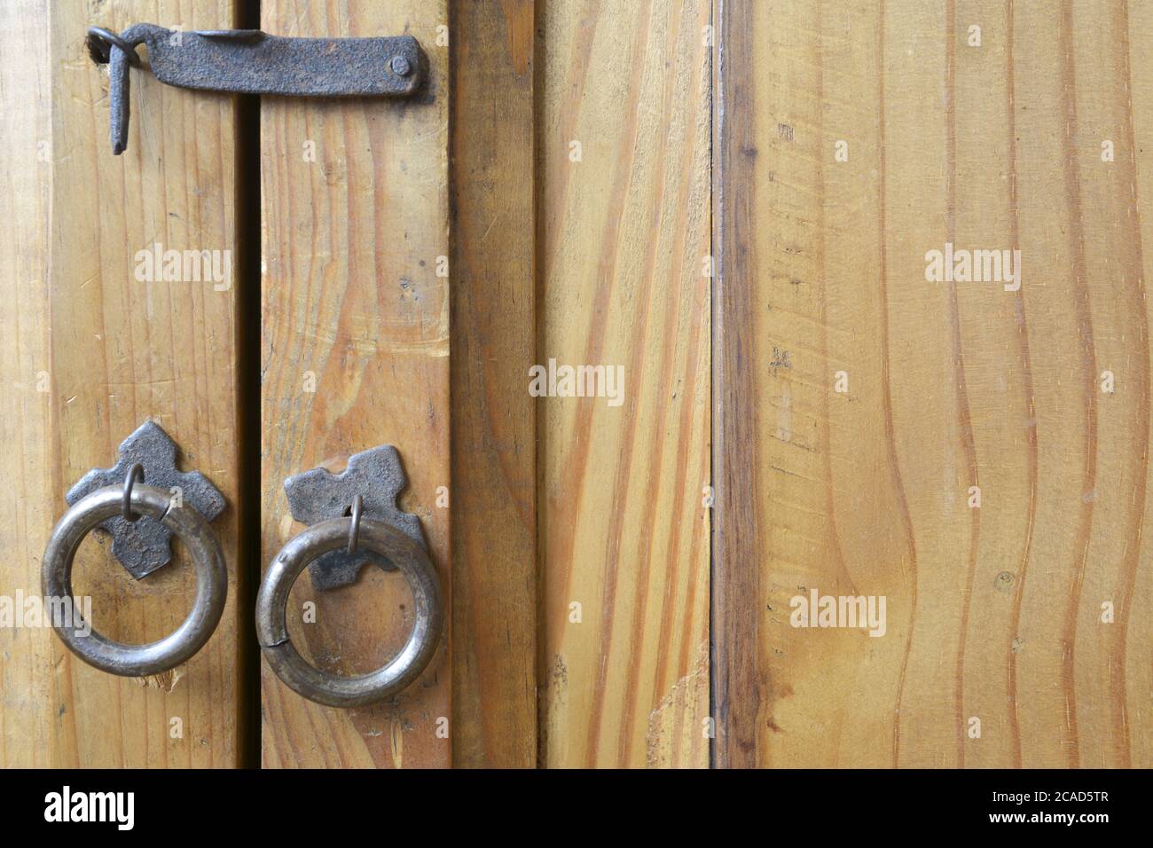 Front view of round decorative metal handles on a wooden door Stock ...