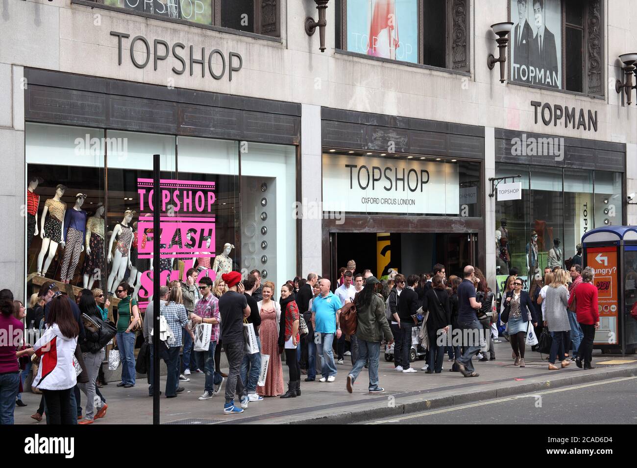 London, UK, Apr 2, 2011 : Topshop clothing store outlet showing there logo  advertising sign at a busy time in Oxford Street stock photo Stock Photo -  Alamy