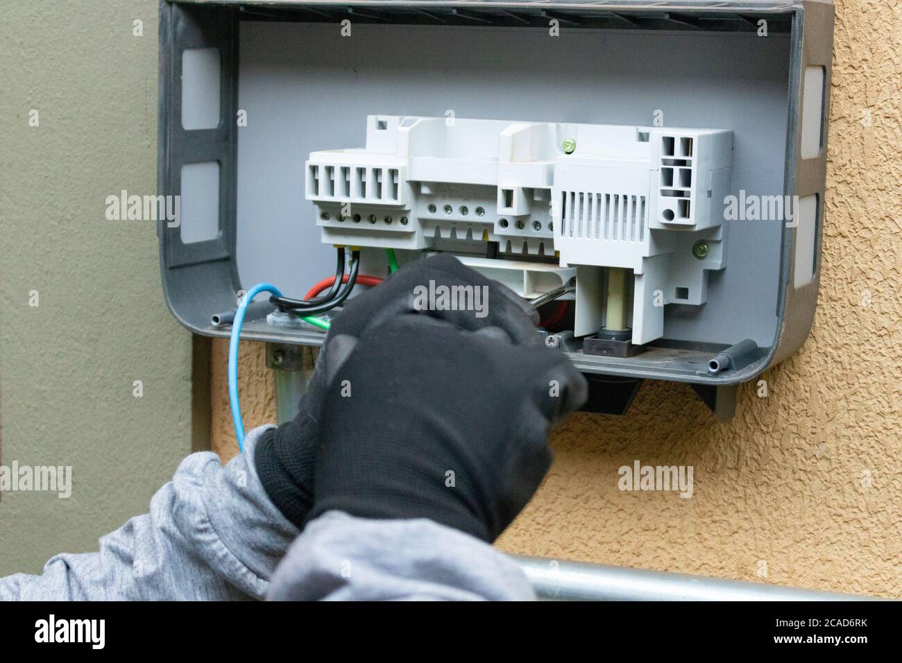 Cleaning and maintenance of the solar inverter. Stock Photo