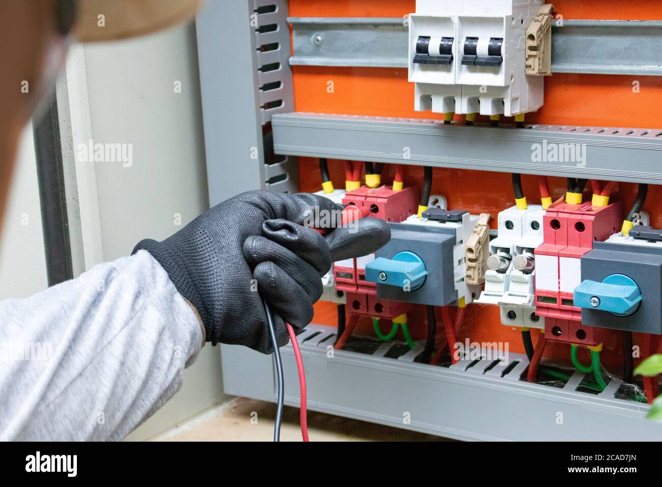 Cleaning and maintenance of the solar inverter. Stock Photo