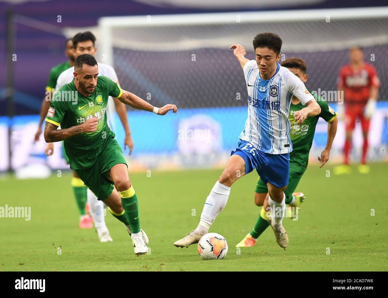 Suzhou, China's Jiangsu Province. 6th Aug, 2020. Renato Augusto (L) of Beijing Sinobo Guoan and Che Shiwei of Tianjin TEDA competes during the third round match at the postponed 2020 season Chinese Football Association Super League (CSL) Suzhou Division in Suzhou, east China's Jiangsu Province, Aug. 6, 2020. Credit: Ji Chunpeng/Xinhua/Alamy Live News Stock Photo