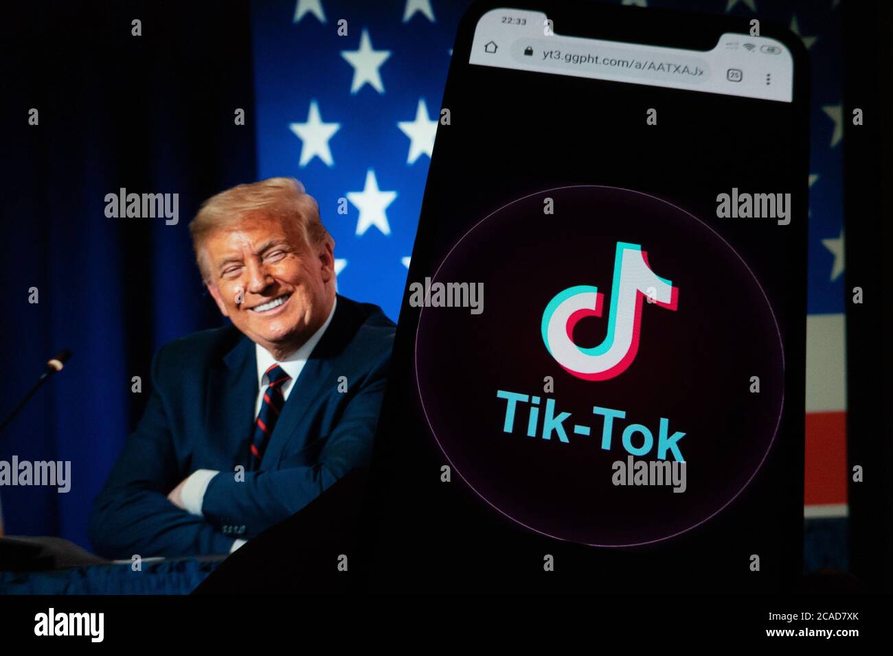 TikTok app on a phone screen and Donald Trump. TikTok is a Chinese video-sharing social networking service owned by ByteDance. Stock Photo