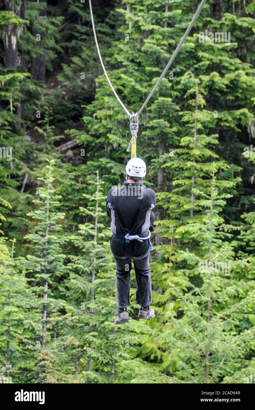 A tourist takes a higher and faster ride on the zip wire above the