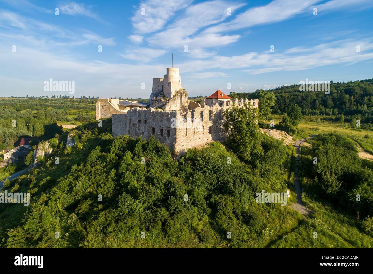 Rabsztyn, Poland. Ruins of medieval royal castle on the rock in Polish Jurassic Highland. Aerial view in sunrise light in summer Stock Photo