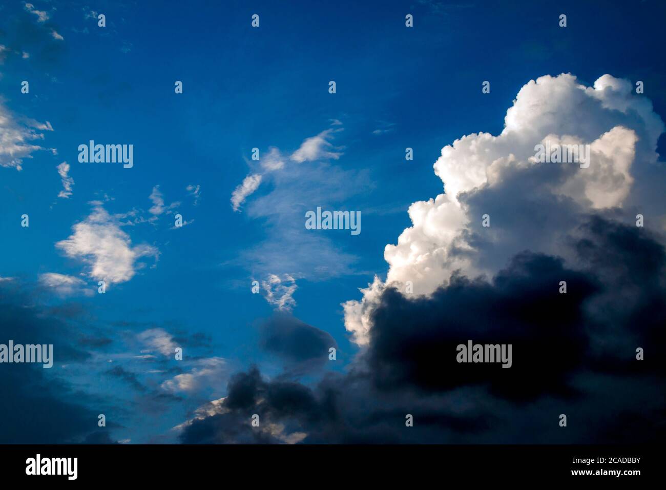 Blue sky with white and black clouds Stock Photo Alamy