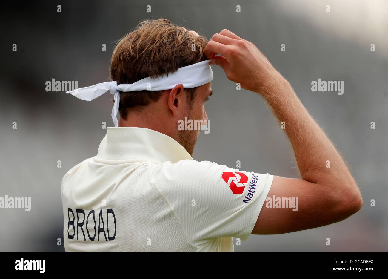England's Stuart Broad replaces his headband during day two of the First  Test match at the Emirates Old Trafford, Manchester Stock Photo - Alamy